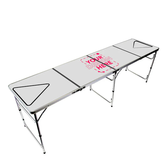 Close-up of a custom beer pong table with bold full-color branding, set with triangular cup racks under event lighting.