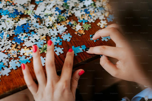 woman adjusting puzzle