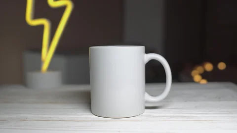 white mug with  thunder sign in background