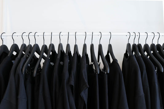 black t shirts on clothing rail