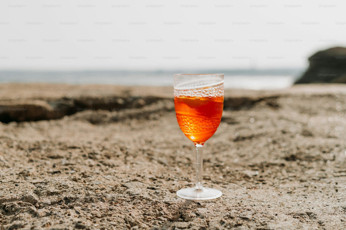 fancy glass tumbler in beach