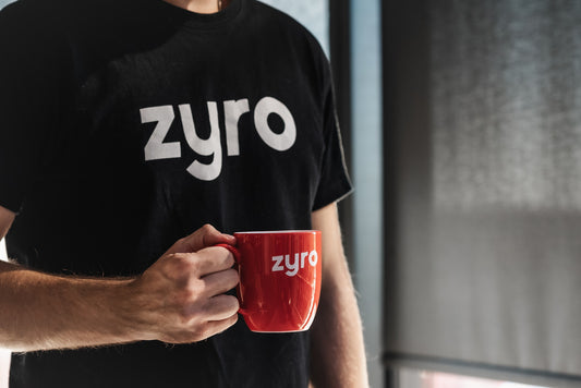 man with printed t shirt and mug